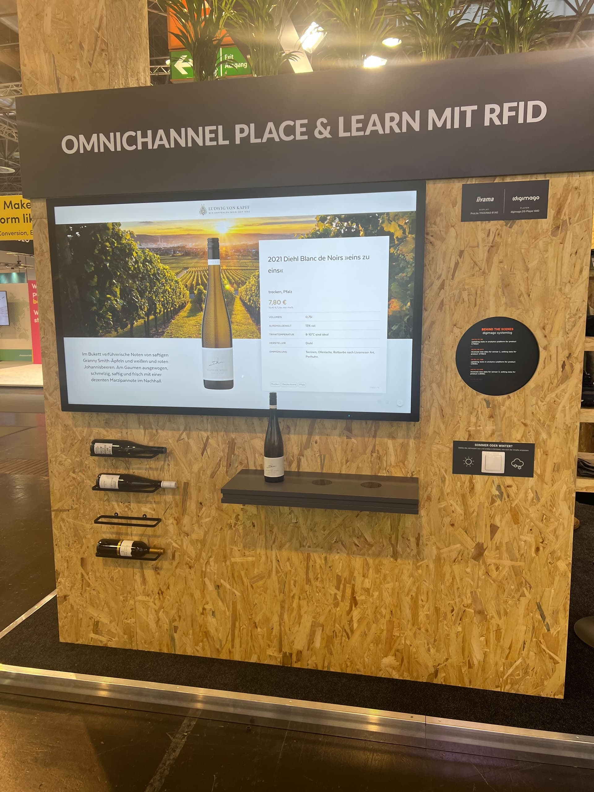 Omnichannel Place & Learn display with wine bottle triggering on-screen information
