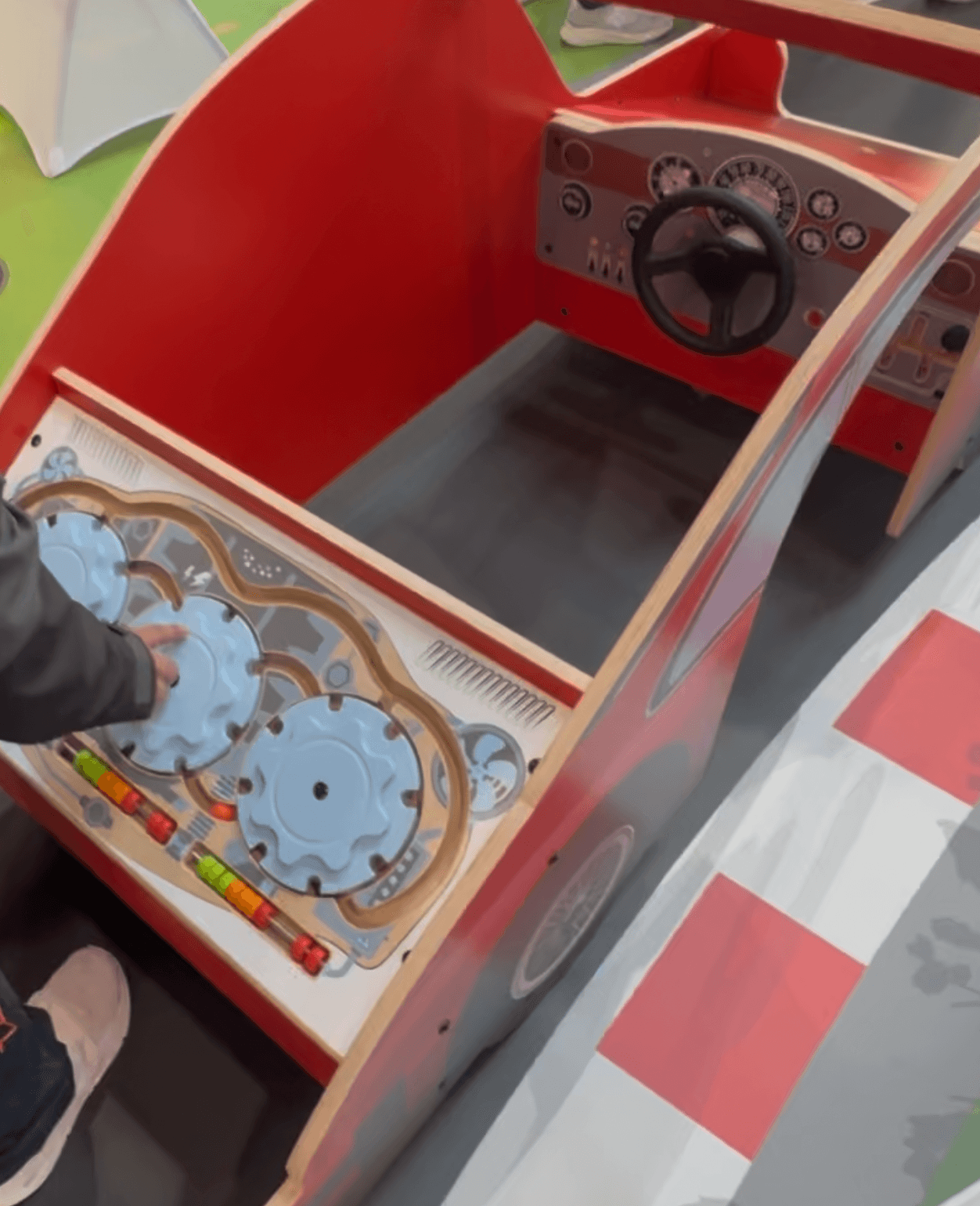 IKC tactile play module with steering wheel and gears